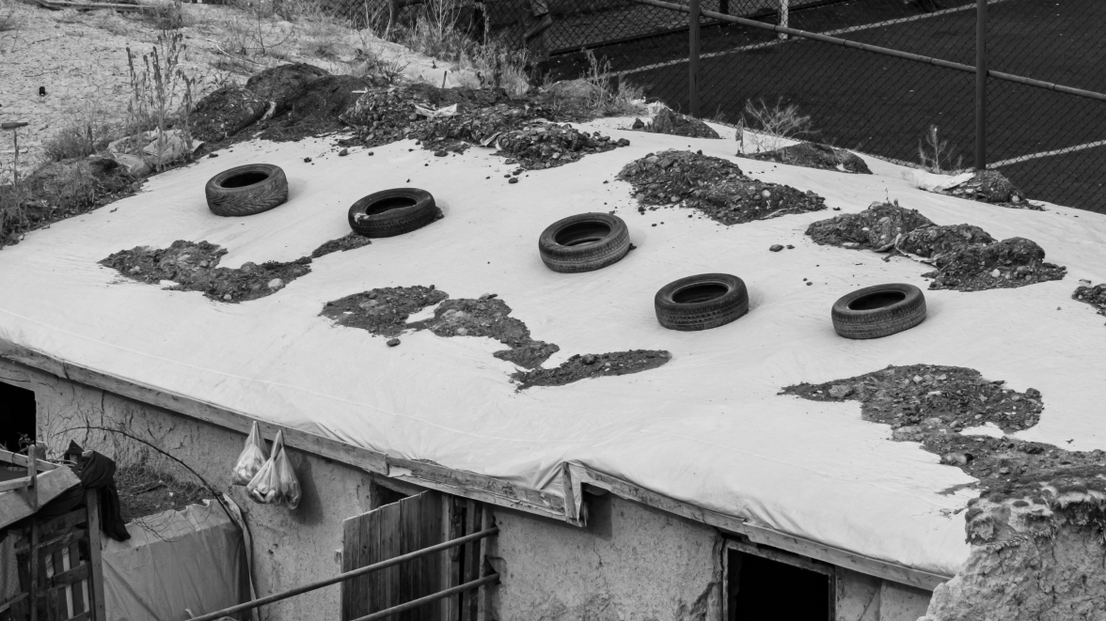 Why Tires Are Placed on Roofs in High-Wind Areas